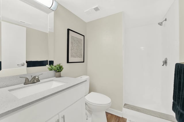 Sink toilet shower with artwork Bathroom at on50 Tampa Apartments in Tampa Student Accommodation