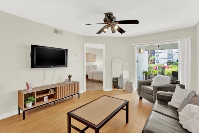 TV media console couch and coffee table living room at on50 Tampa Apartments in Tampa Student Accommodation