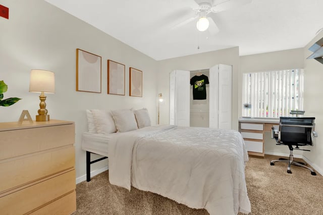 Bed dresser desk and closet bedroom at on50 Tampa Apartments in Tampa Student Accommodation