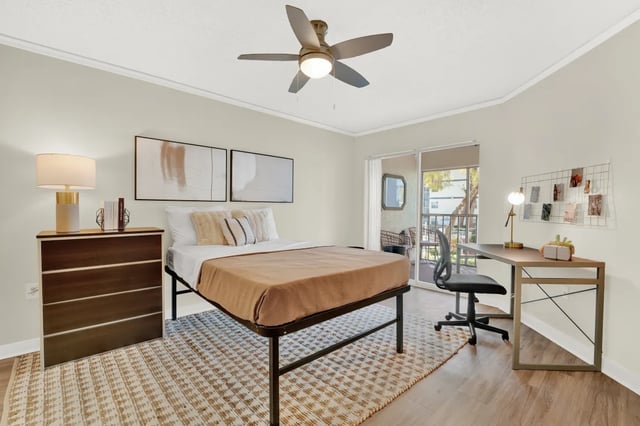 Bed dresser desk and chair bedroom at on50 Tampa Apartments in Tampa Student Accommodation