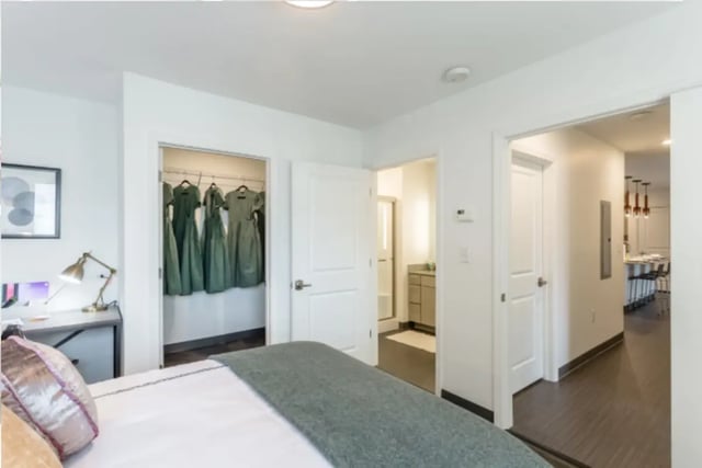 Bed with closet desk and bathroom bedroom at Altitude Apartments Harrisonburg in Harrisonburg Student Accommodation