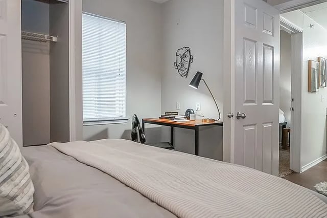 Desk lamp books and chair study area at The Leonard Denton in Denton Student Accommodation