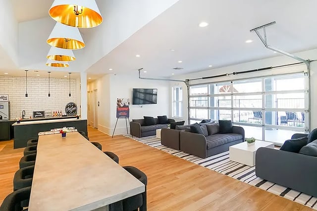 Sofa coffee bar and large table living area at The Leonard Denton in Denton Student Accommodation