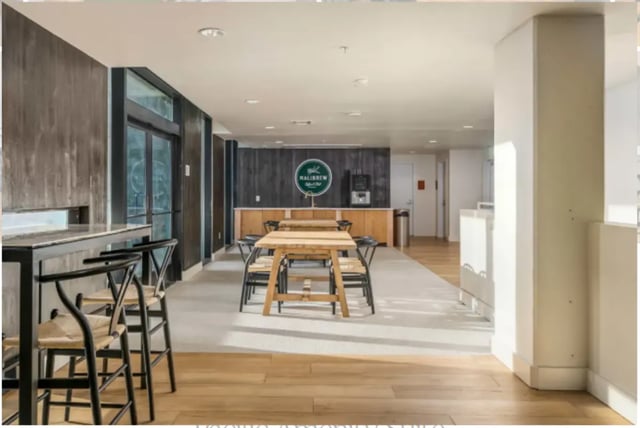 Bar stools tables and a coffee station common area at The Pacific and Malibu in Tucson Student Accommodation