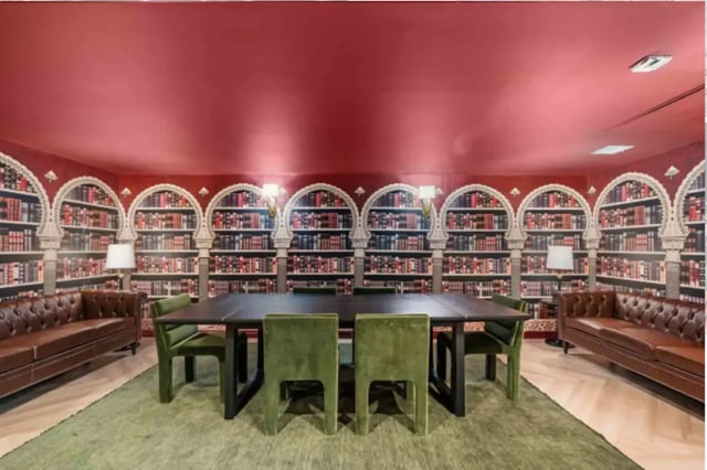 Library with brown couches and green chairs study area at The Pacific and Malibu in Tucson Student Accommodation