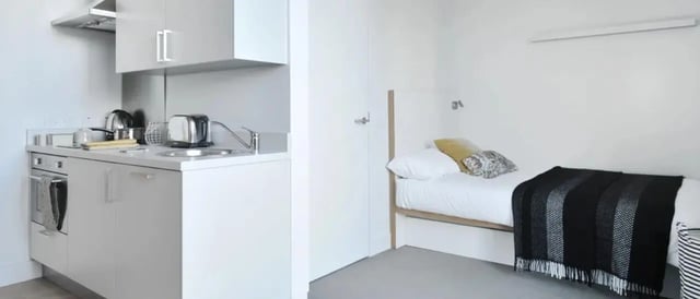 Kitchenette with bed in room bedroom at Victoria Hall Kings Cross in London Student Accommodation