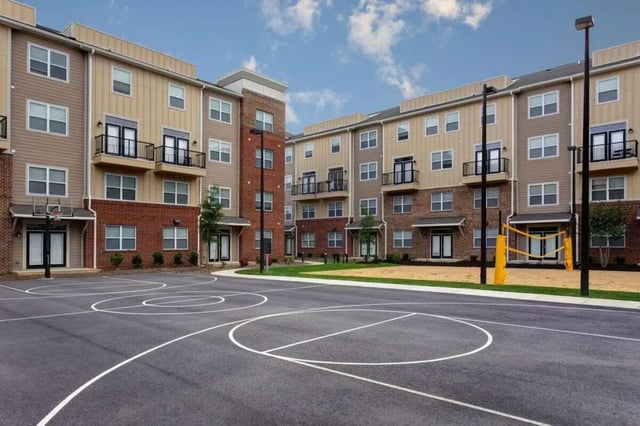 Basketball court with volleyball net exterior at The James Apartments Richmond in Richmond Student Accommodation