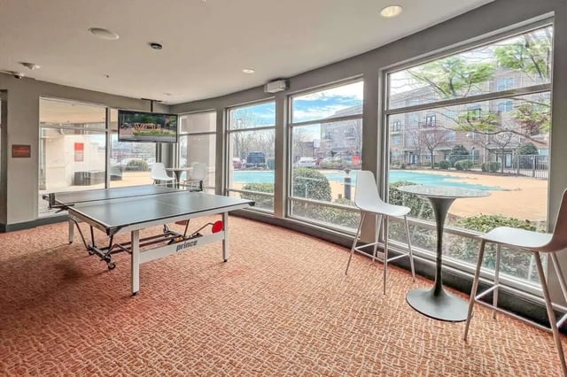 Ping pong table television high stools amenity area at The James Apartments Richmond in Richmond Student Accommodation