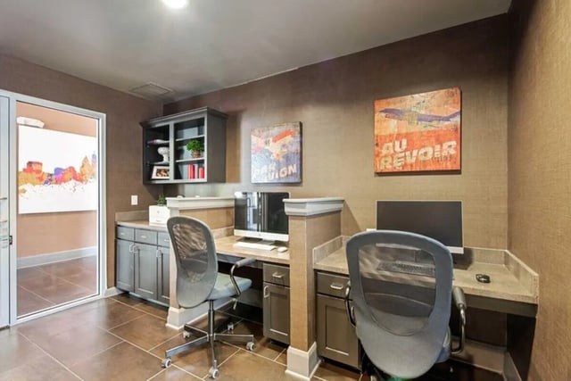 Two computer stations with desks and chairs study area at University Edge-Cincinnati in Cincinnati Student Accommodation