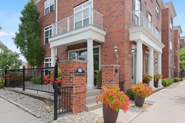 Brick building entrance with columns and flowers exterior at University Edge-Cincinnati in Cincinnati Student Accommodation