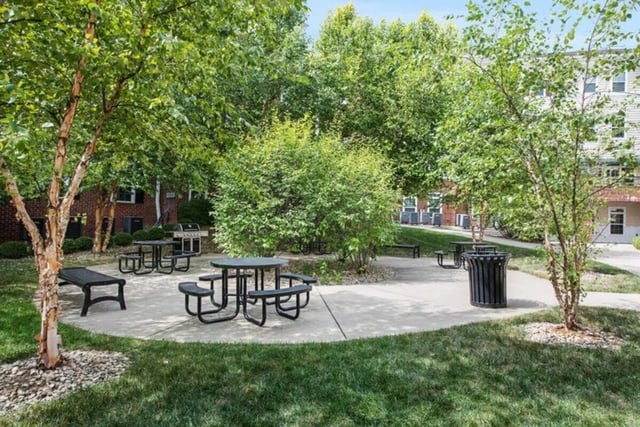 Picnic tables grills and trash can exterior at University Edge-Cincinnati in Cincinnati Student Accommodation