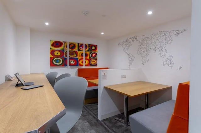 Booths with art and world map study area at Bloomsbury Janet Poole House in London Student Accommodation