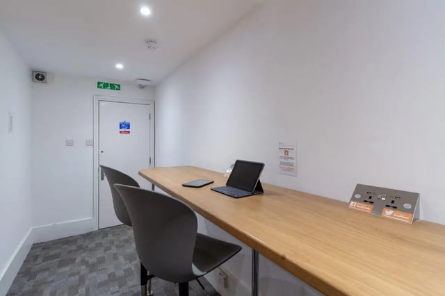 Table with laptops and chairs study area at Bloomsbury Janet Poole House in London Student Accommodation