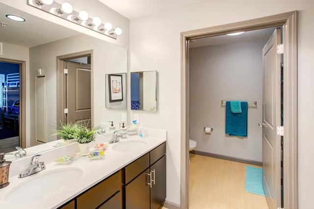 Double vanity mirrors sink and toilet bathroom at Student Living at Florida Polytechnic University in Lakeland Student Accommodation