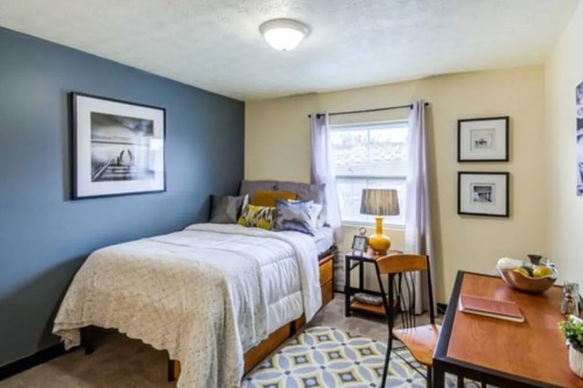 Bed with pillows desk with chair bedroom at West Run in Morgantown Student Accommodation