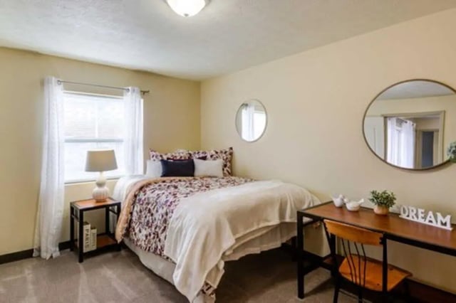 Bed bedside table desk and chair bedroom at West Run in Morgantown Student Accommodation