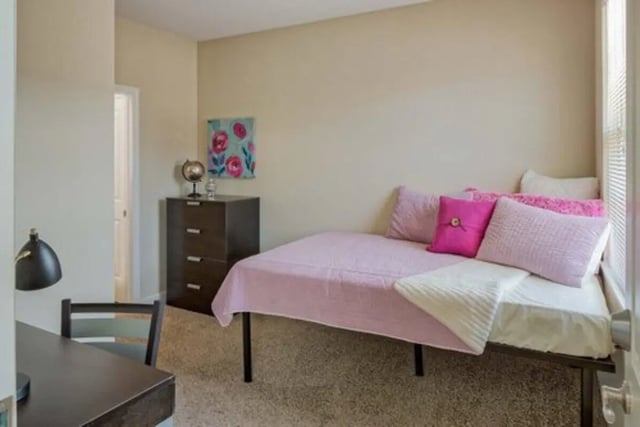 Bed desk dresser pillows and painting bedroom at Irish Flats in South Bend Student Accommodation