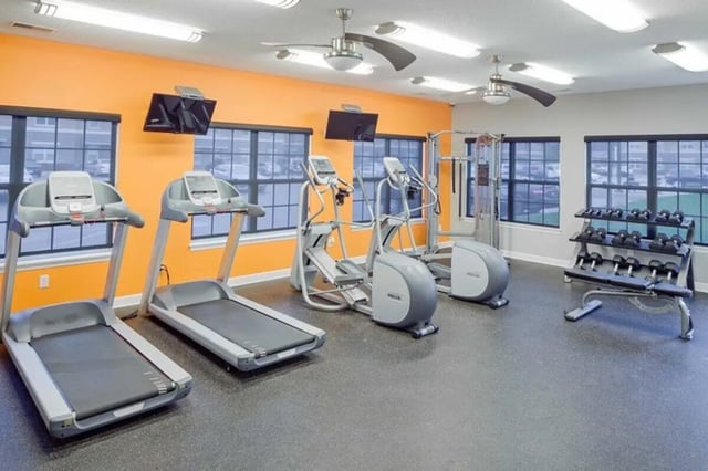 Treadmills ellipticals weight rack fitness gym at Irish Flats in South Bend Student Accommodation