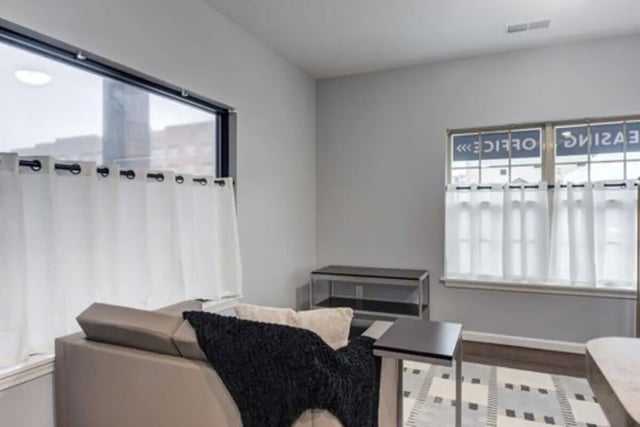 Sofa with blanket and table Living room at Overlook at Notre Dame in South Bend Student Accommodation