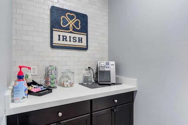 Coffee station with pods and dispenser common area at Overlook at Notre Dame in South Bend Student Accommodation