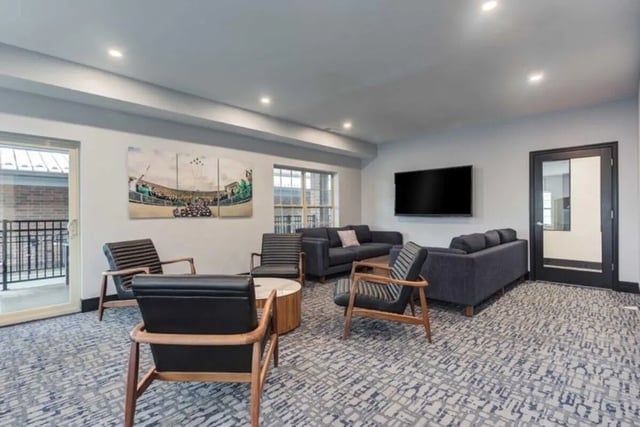 Seating area with sofas and chairs living room at Overlook at Notre Dame in South Bend Student Accommodation