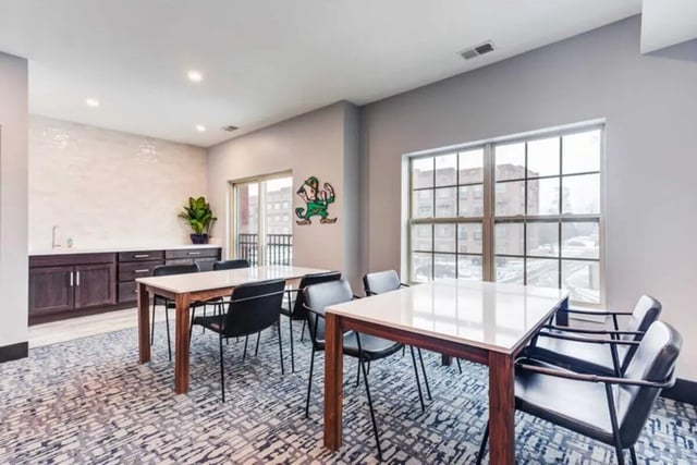 Two tables with chairs study area at Overlook at Notre Dame in South Bend Student Accommodation