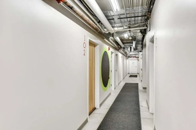 Doors hallway with numbered doors and carpet hallway at The Abigail in Columbus Student Accommodation