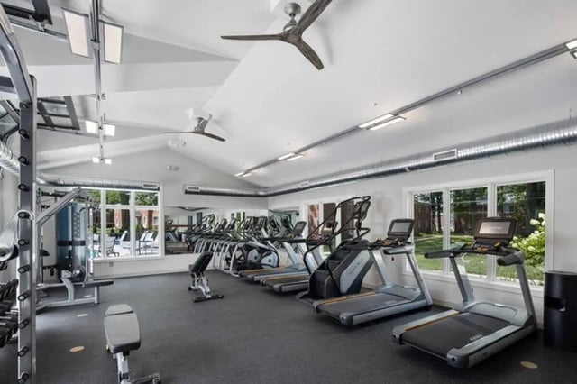 Treadmills steppers weight machine gym area at The Flats at Douglas in Toledo Student Accommodation