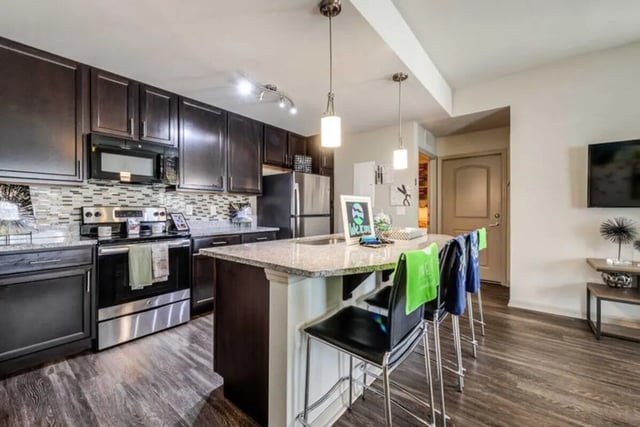 Modern kitchen with island and appliances kitchen at The Reef in Fort Myers Student Accommodation