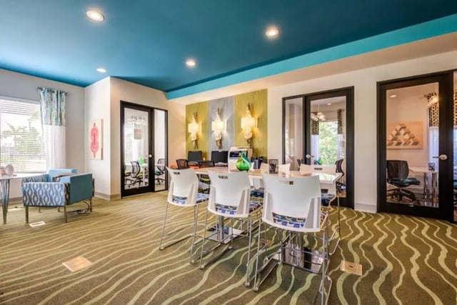 Study area with white chairs and tables study area at The Reef in Fort Myers Student Accommodation