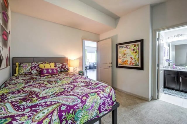 Colorful paisley bedding with lamp bedroom at The Reef in Fort Myers Student Accommodation