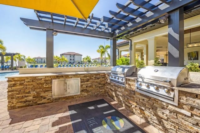 Two grills outdoor kitchen grilling area exterior at The Reef in Fort Myers Student Accommodation