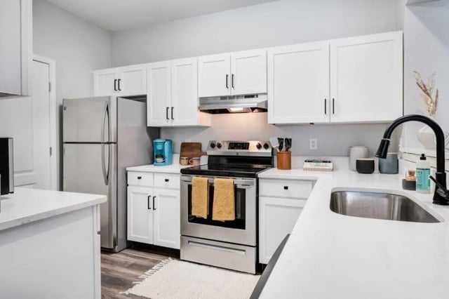 Stainless steel appliances and white cabinets kitchen at The Lodge on the Trail in West Lafayette Student Accommodation