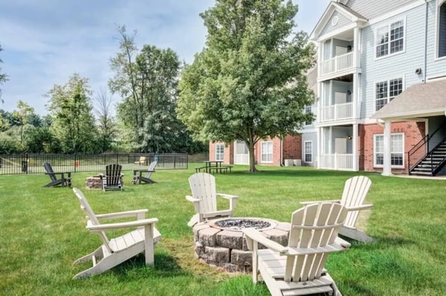 Adirondack chairs around fire pit exterior at The Lodge on the Trail in West Lafayette Student Accommodation