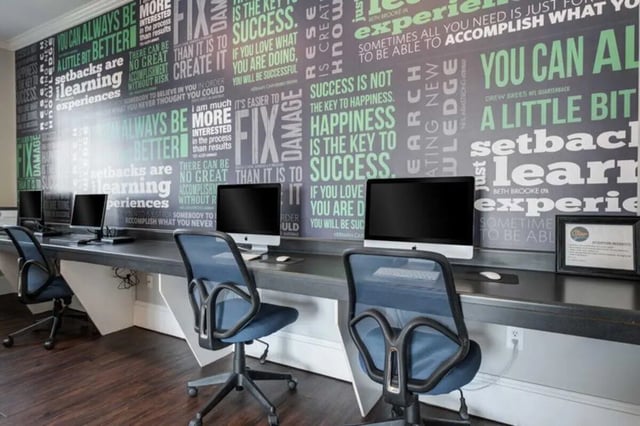 Computers with motivational quotes wall study area at The Lodge on the Trail in West Lafayette Student Accommodation