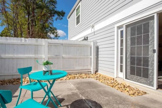 Teal patio table and chairs exterior at Terrace View in Blacksburg Student Accommodation