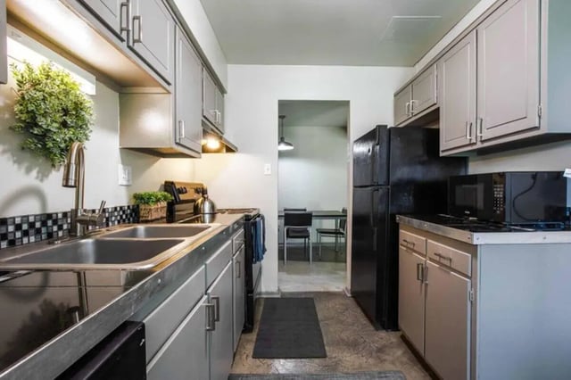 Sink refrigerator microwave with cabinets kitchen at Terrace View in Blacksburg Student Accommodation