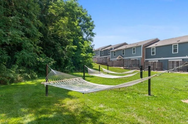 Hammocks strung on green lawn outdoor amenity at Terrace View in Blacksburg Student Accommodation