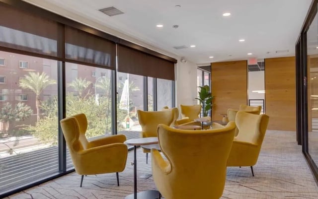 Yellow armchairs around tables lounge area at Nine 20 Tempe in Tempe Student Accommodation