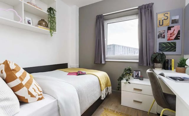Bed bedside table shelves desk bedroom at New Medlock House in Manchester Student Accommodation