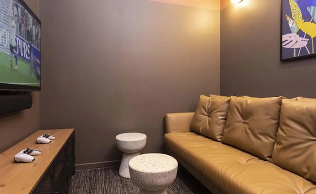TV console couch and controllers common area at Parkway Gate in Manchester Student Accommodation