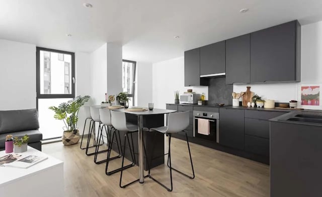 Modern kitchen with island and seating kitchen at Parkway Gate in Manchester Student Accommodation