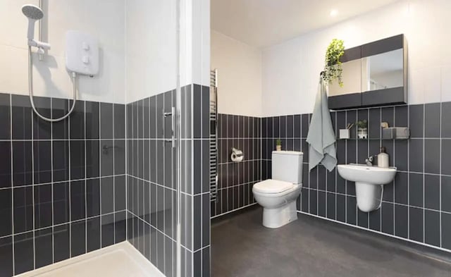 Shower toilet sink and mirror bathroom at Parkway Gate in Manchester Student Accommodation