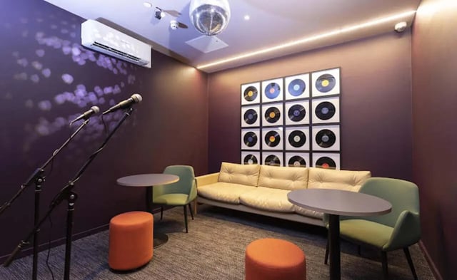 Microphones sofa chairs records playing area at Parkway Gate in Manchester Student Accommodation