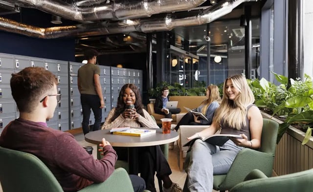 Students relaxing in lounge area with lockers living room at Parkway Gate in Manchester Student Accommodation