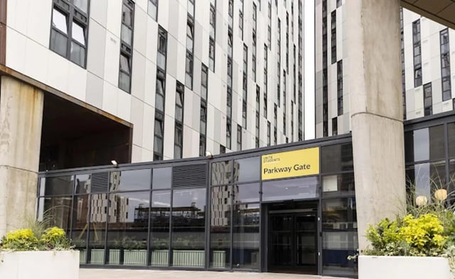 Modern building entrance with Parkway Gate sign Exterior at Parkway Gate in Manchester Student Accommodation
