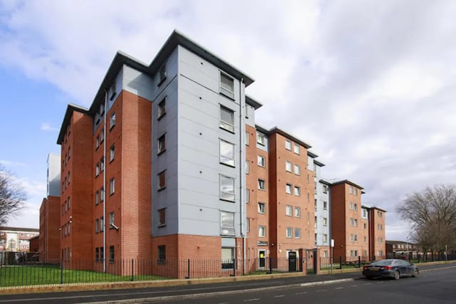 Tall brick and gray apartment buildings exterior at Kincardine Court in Manchester Student Accommodation