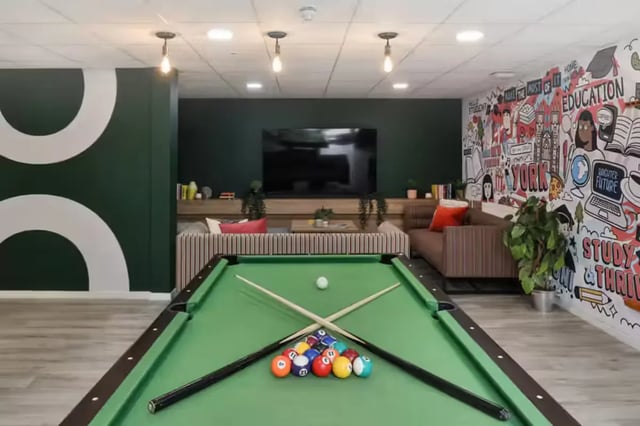 Pool table with balls and cues living room at Foss Studios in York Student Accommodation