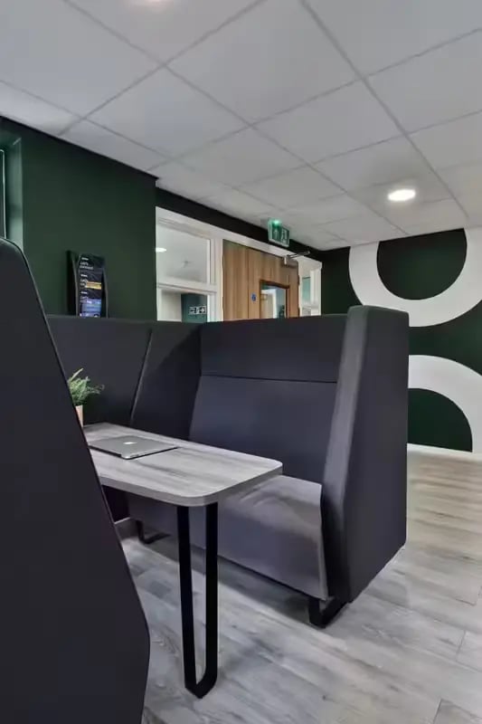 Booth seating with laptop and plant study area at Foss Studios in York Student Accommodation