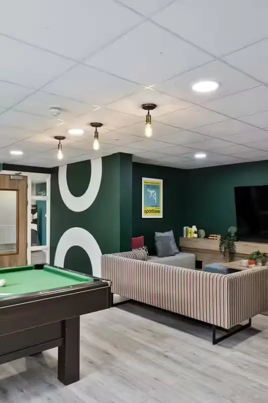 Pool table sofa and TV living room at Foss Studios in York Student Accommodation